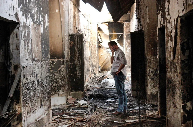 An employee of Doctors Without Borders in October 2015 inside what remained of the organization’s hospital, destroyed in an airstrike that left 42 people dead. (Najim Rahim/AP)