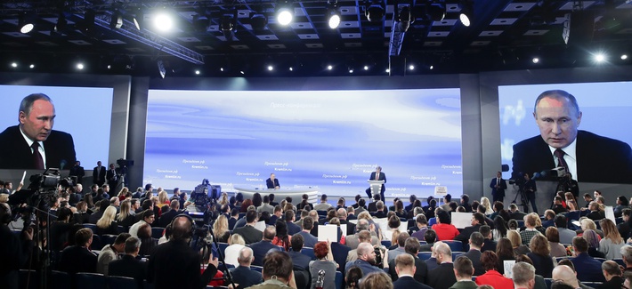 Russian President Vladimir Putin, center back, speaks during his annual news conference in Moscow, Russia, Friday, Dec. 23, 2016. (Pavel Golovkin/AP)