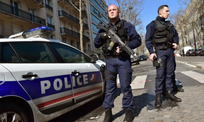 French police officers secure the scene near the Paris offices of the International Monetary Fund (IMF) on March 16, 2017, after a letter bomb exploded in the premises. (Christophe Archambault/Getty)