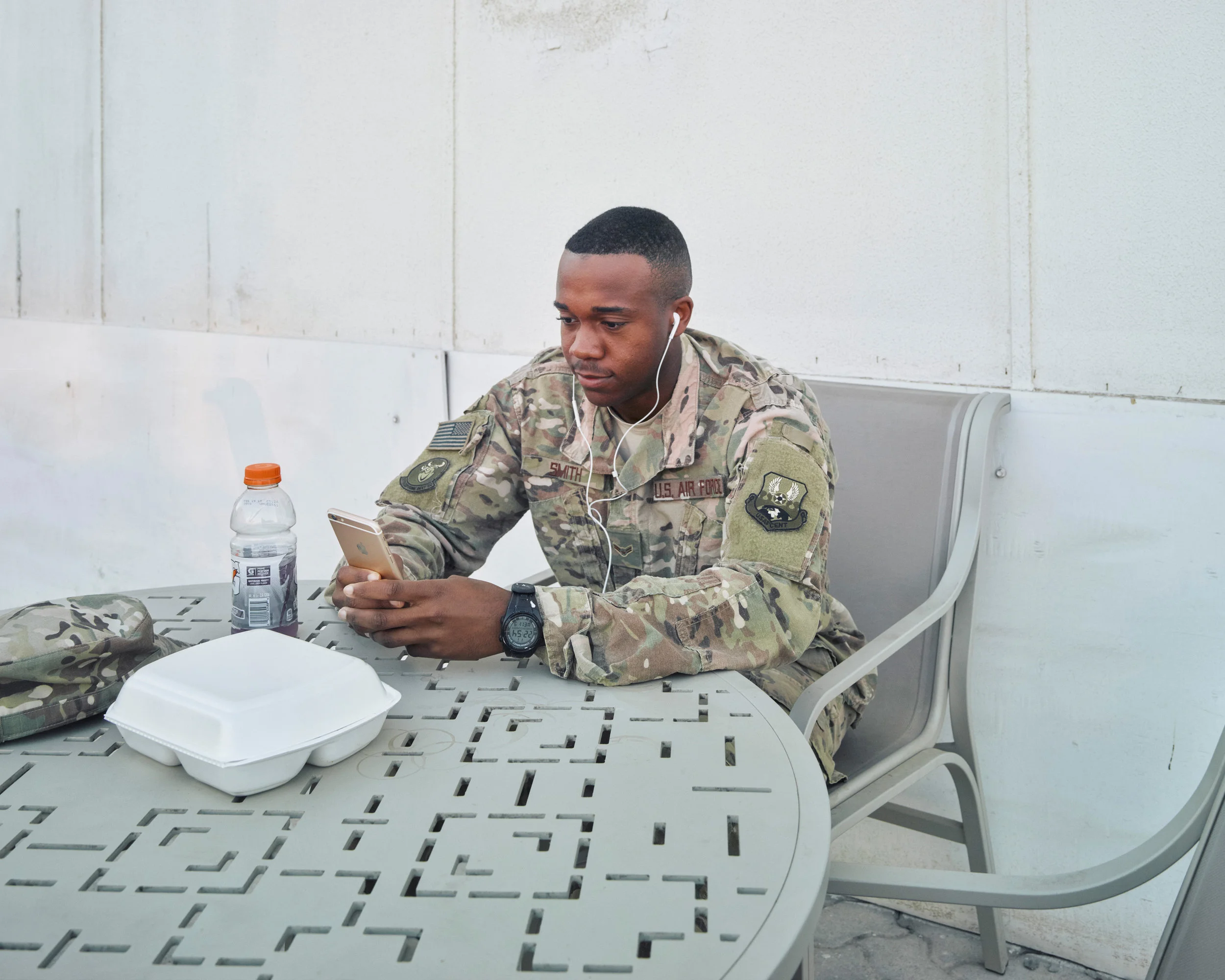 Portrait of an airman: An airman makes a video call back to his family in the United States from an undisclosed location in Southwest Asia. ( Jason Koxvold )