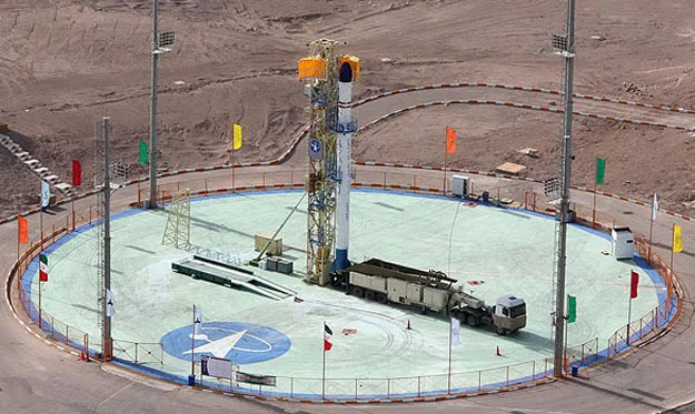 A Safir space launch vehicle carrying the Rasad satellite is readied for launch at the Semnan launch site in Iran. (Spacewatch)