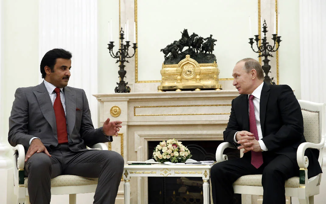 Russian President Vladimir Putin speaks with Qatar's Emir Tamim bin Hamad Al Thani in Moscow on Jan. 18, 2016. (Yuri Kochetkov/AP)