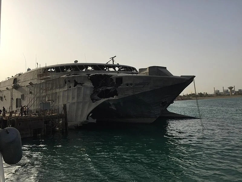 Swift in port at Oceandro Large Yacht shipyard, Port Suez, Egypt. Damage to the starboard bow from the alleged Houthi rebel attack is clearly visible. (Wikimedia)