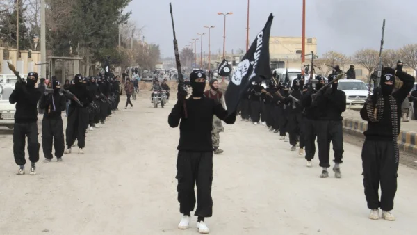 Islamic State militants parade in Tel Abyad, near Syria's border with Turkey. (Yaser Al-Khodor/Reuters)