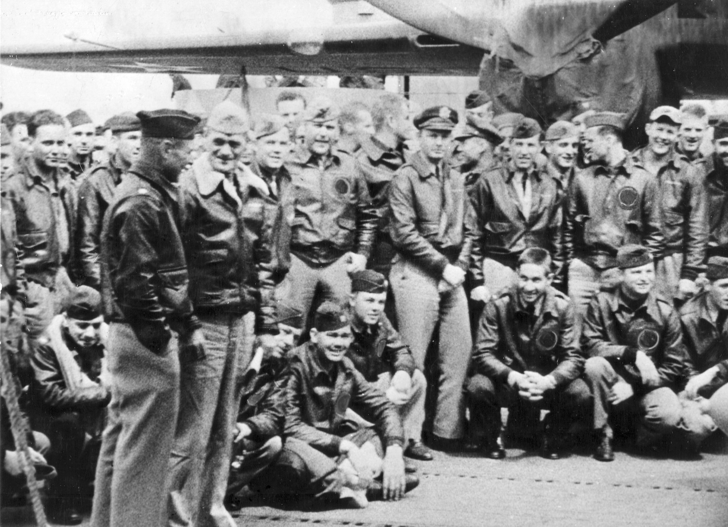  Orders in hand, Capt. Marc A. Mitscher, U.S.N., skipper of the U.S.S. Hornet (CU-8) chats with Maj. Gen. James Doolittle, U.S. Army. Some of the 80 Army fliers who took part in the historic Japanese raid are pictured with the two fliers. (Wikimedia)