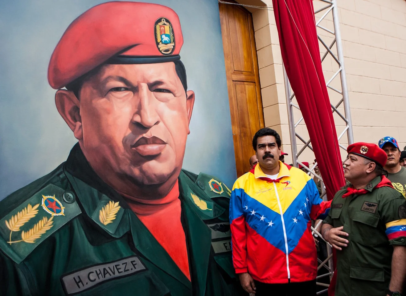 Venezuelan President Nicolas Maduro poses with Socialist Party Vice-President Diosdado Cabello next to a portrait of Hugo Chavez. (Photo by Jorge Silva/Reuters)