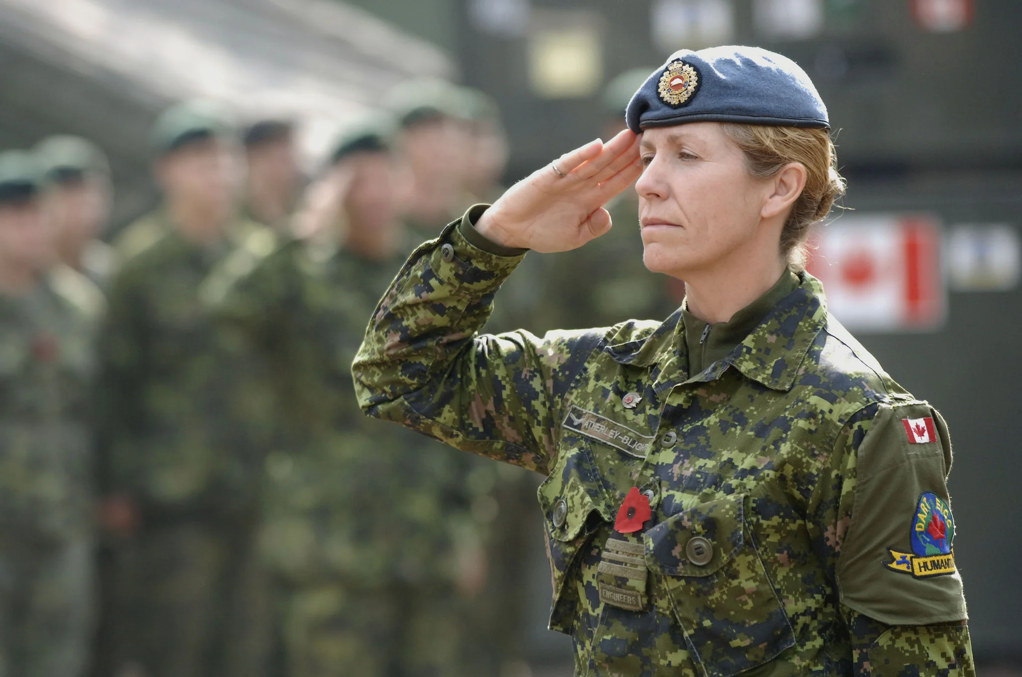 Major Julia Atherley-Blight, Deputy Commanding Officer of the Canadian Forces Disaster Assistance Response Team, salutes during a Remembrance Day ceremony in Pakistan (Sgt Frank Hudec/Canadian Forces)