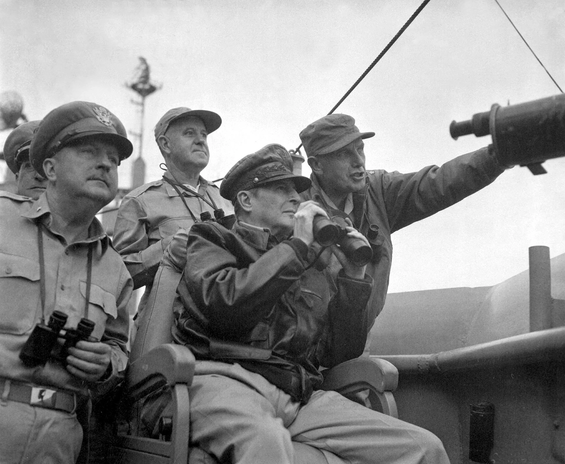 Brigadier General Courtney Whitney, General Douglas MacArthur, and Major General Edward Almond observe the shelling of Incheon from the USS Mount McKinley on 15 September 1950. (U.S. Army Photo/Wikimedia)