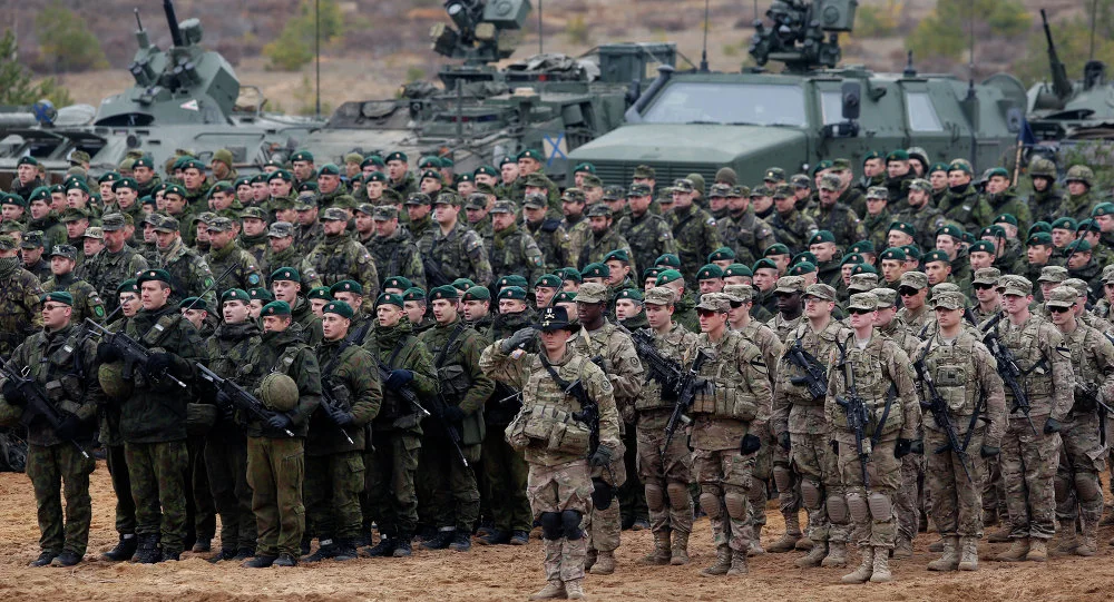 Parade of troops and equipment at the end of a NATO exercise in Lithuania (Mindaugas Kulbis/AP)