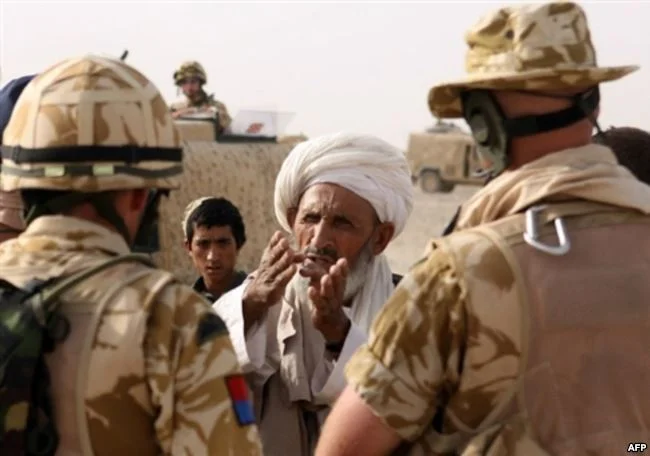 Coalition soldiers meet with local Afghan elders in Helmand Province. (AFP)