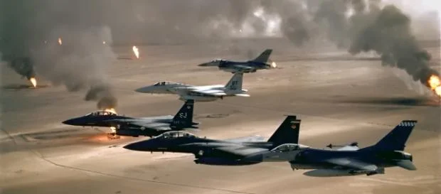 F-15 and F-16 flying over Kuwaiti oil fires during the Gulf War in 1991. (Wikimedia)