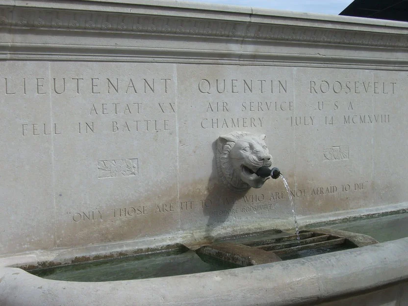 In the little village of Chamery stands the fountain erected by the family of First Lieutenant Quentin Roosevelt, youngest son of President Theodore Roosevelt, killed in a dogfight over the area on July 14th 1918. (American Remembrance)
