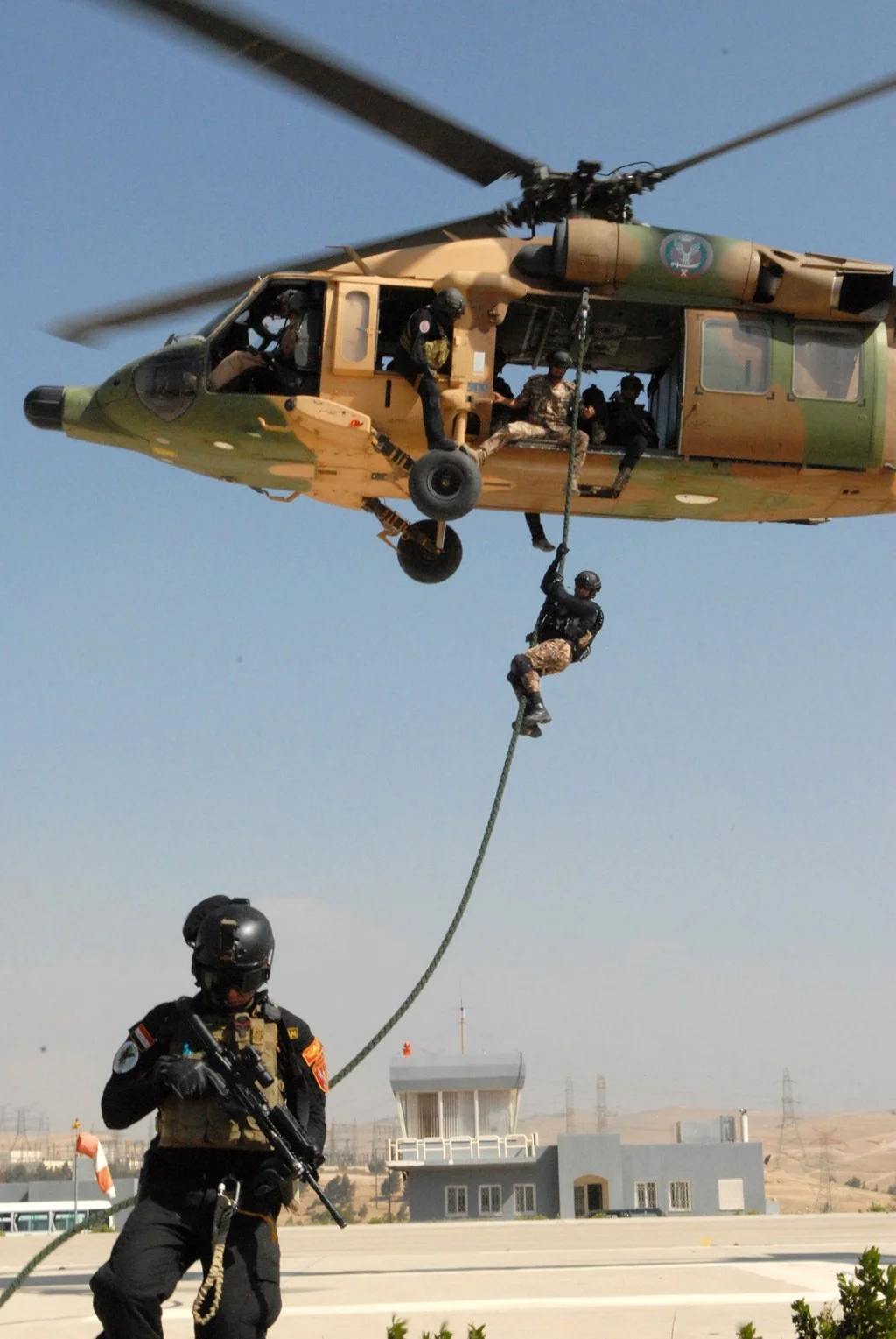 A member of the Jordanian SOF descends from a Jordanian UH-60 Black Hawk helicopter at the Jordanian SOF compound near Zarqa, Jordan, June 13, 2013. Jordan is one of the major Foreign Military Financing recipients. (SSG Scott Griffin/U.S. Army Photo)
