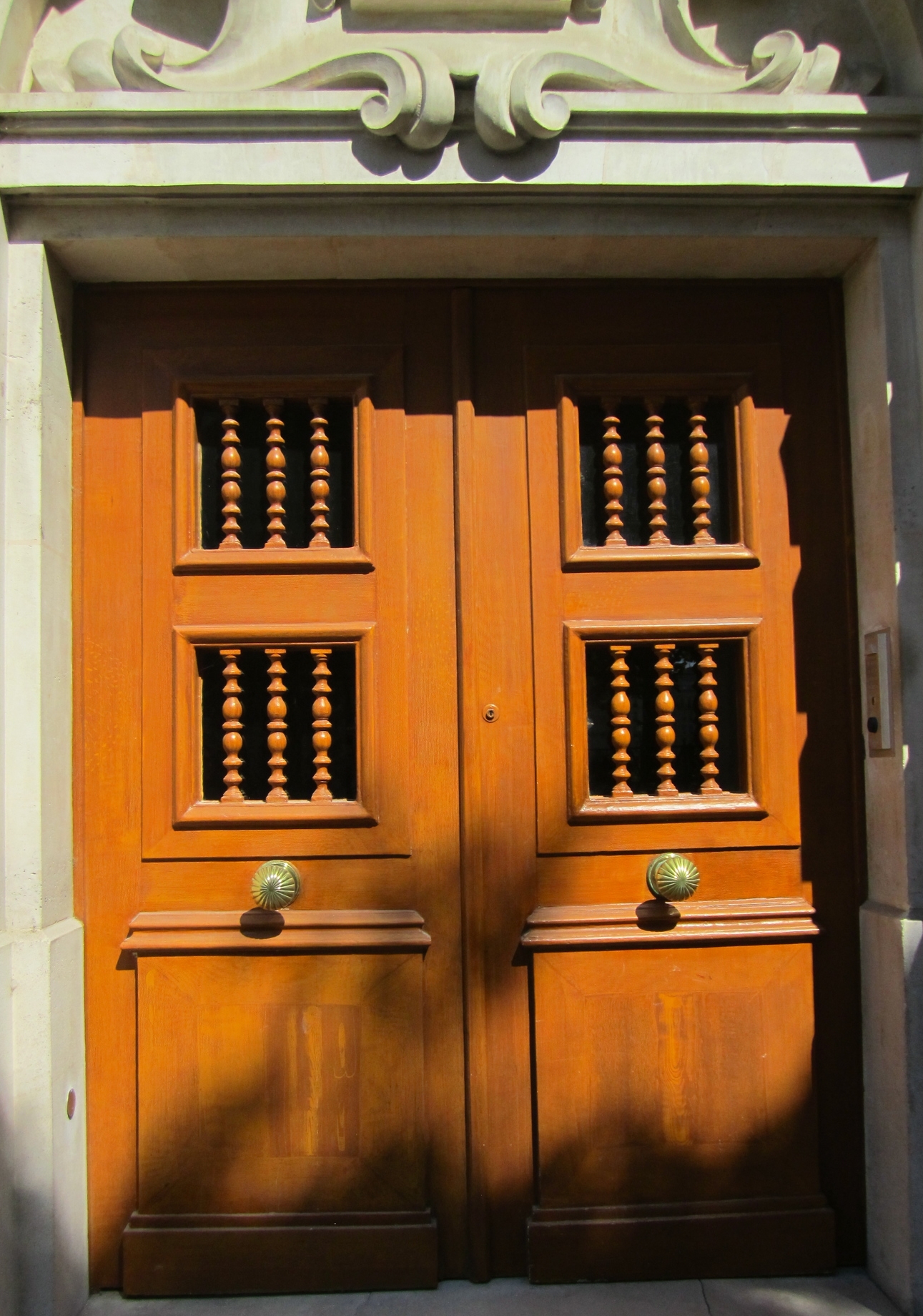 Center door knobs on a random building along a Parisian street.