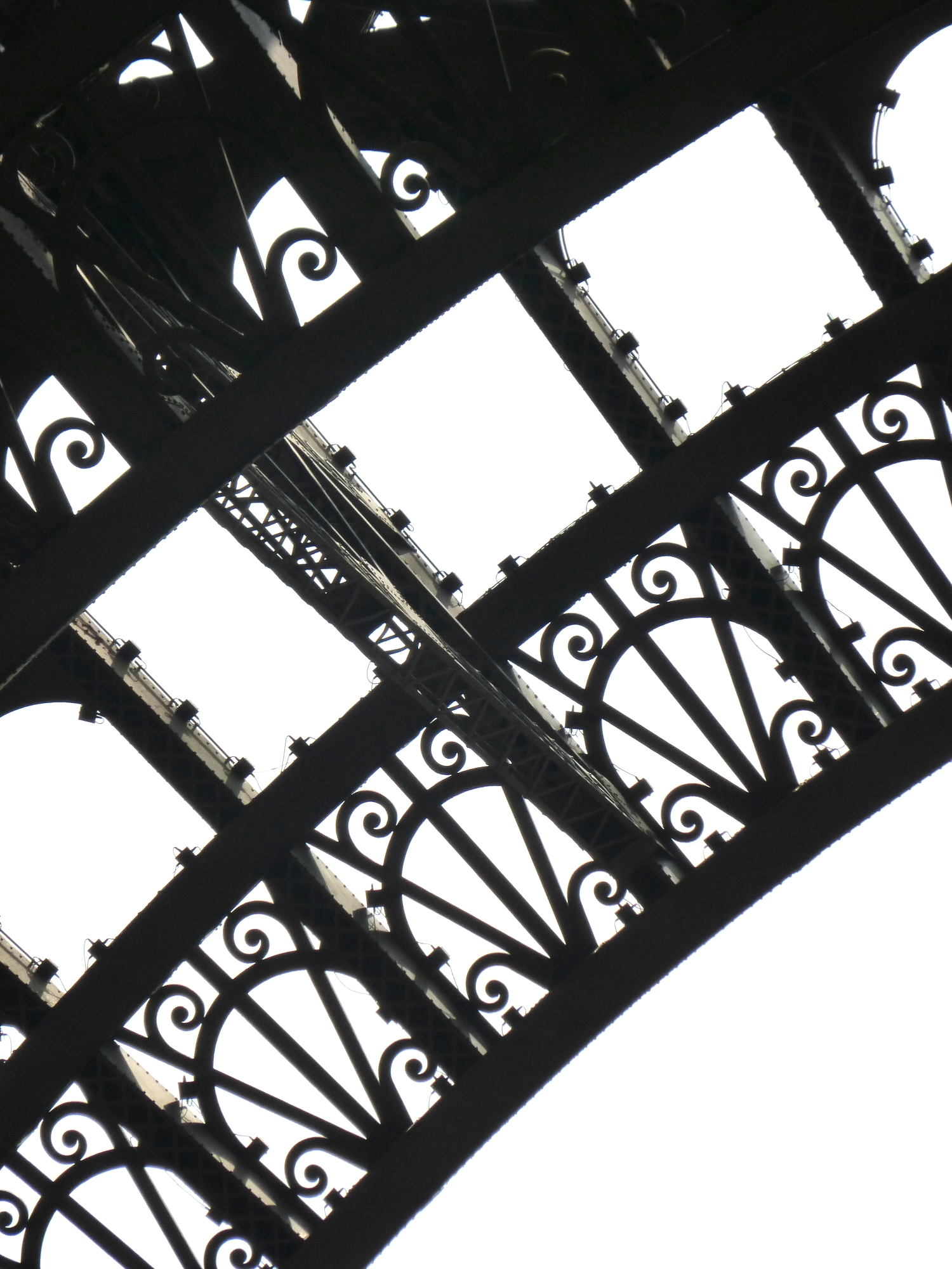 The massive, yet delicate appearing ironwork on the Tour de Eiffel.