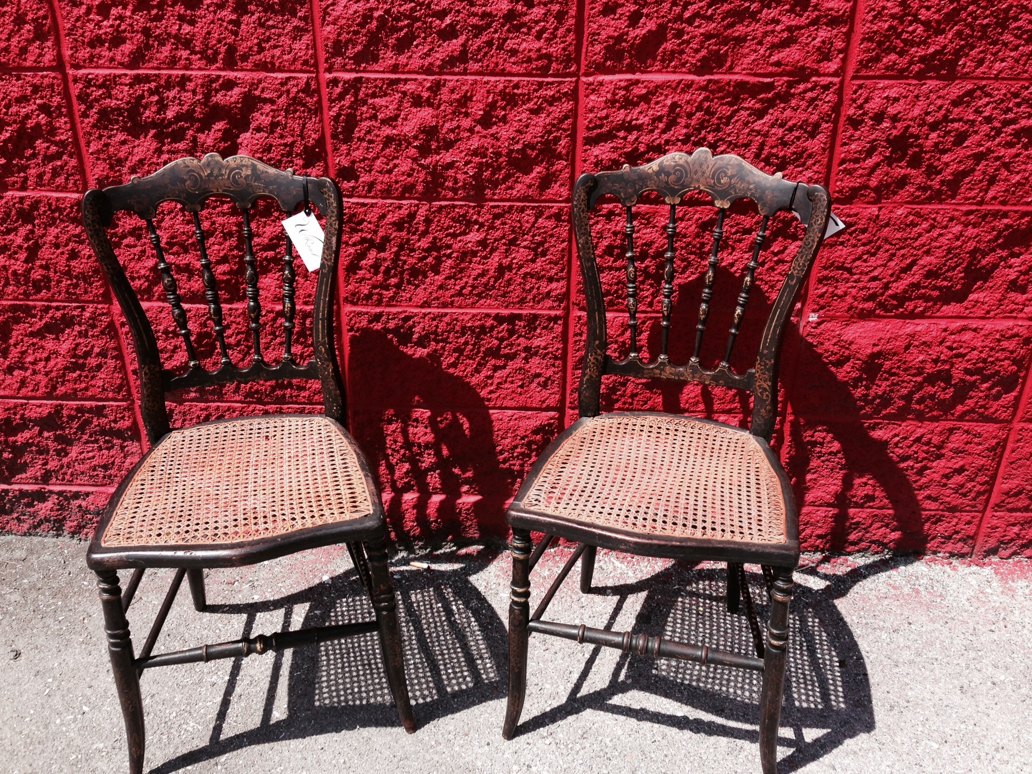 Early 1900's cane seat hand painted spindle back chairs.