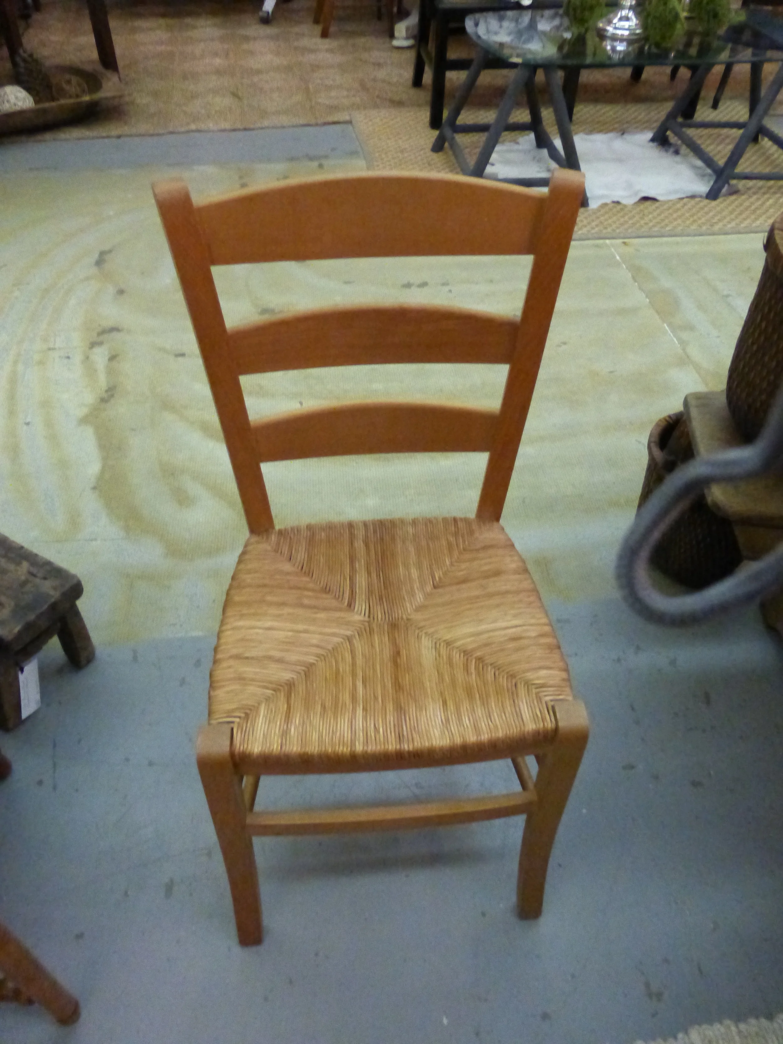 Small rush seat chair is in set of four.