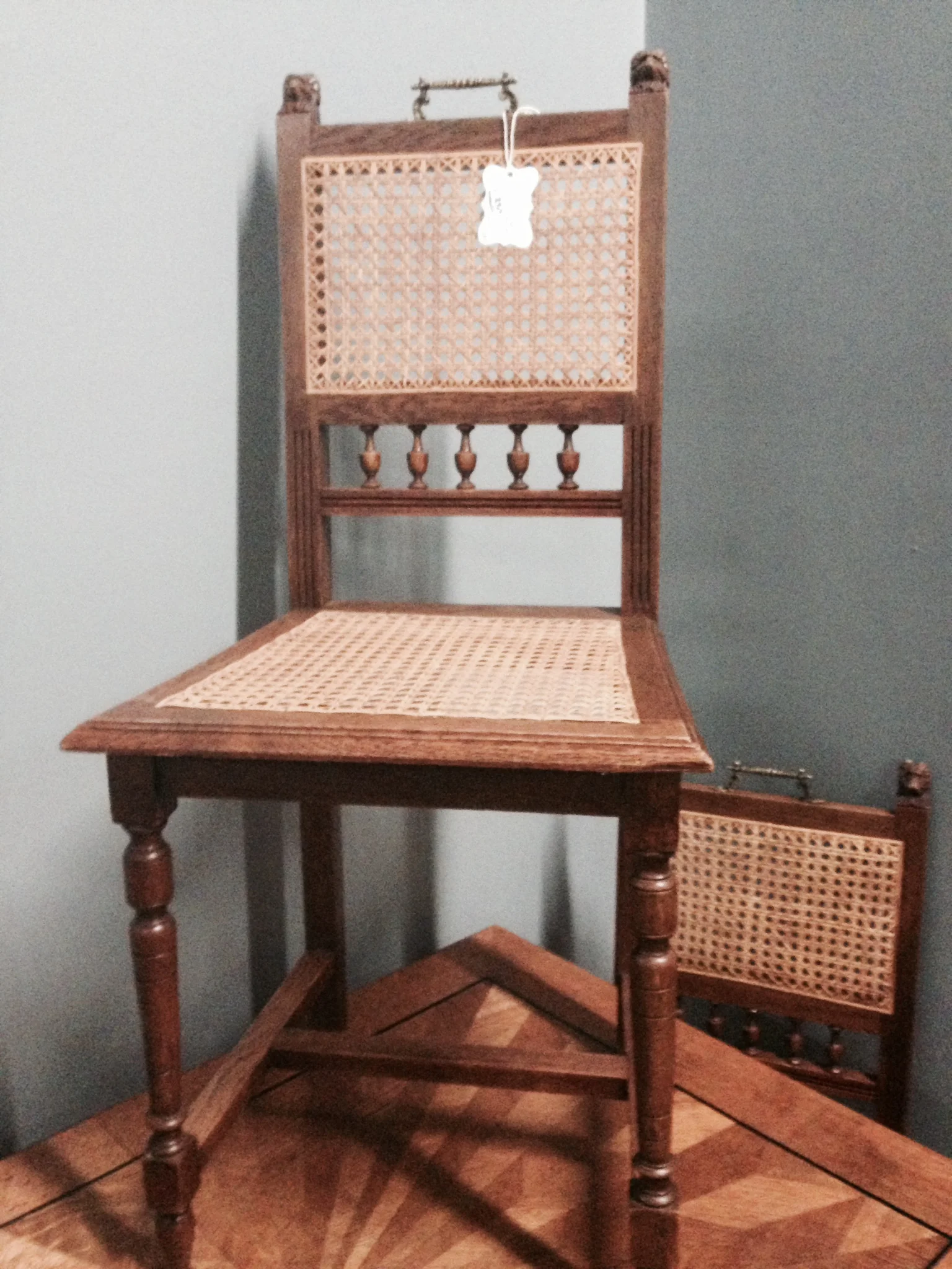 Love the pull handles on this set of four caned French chairs.