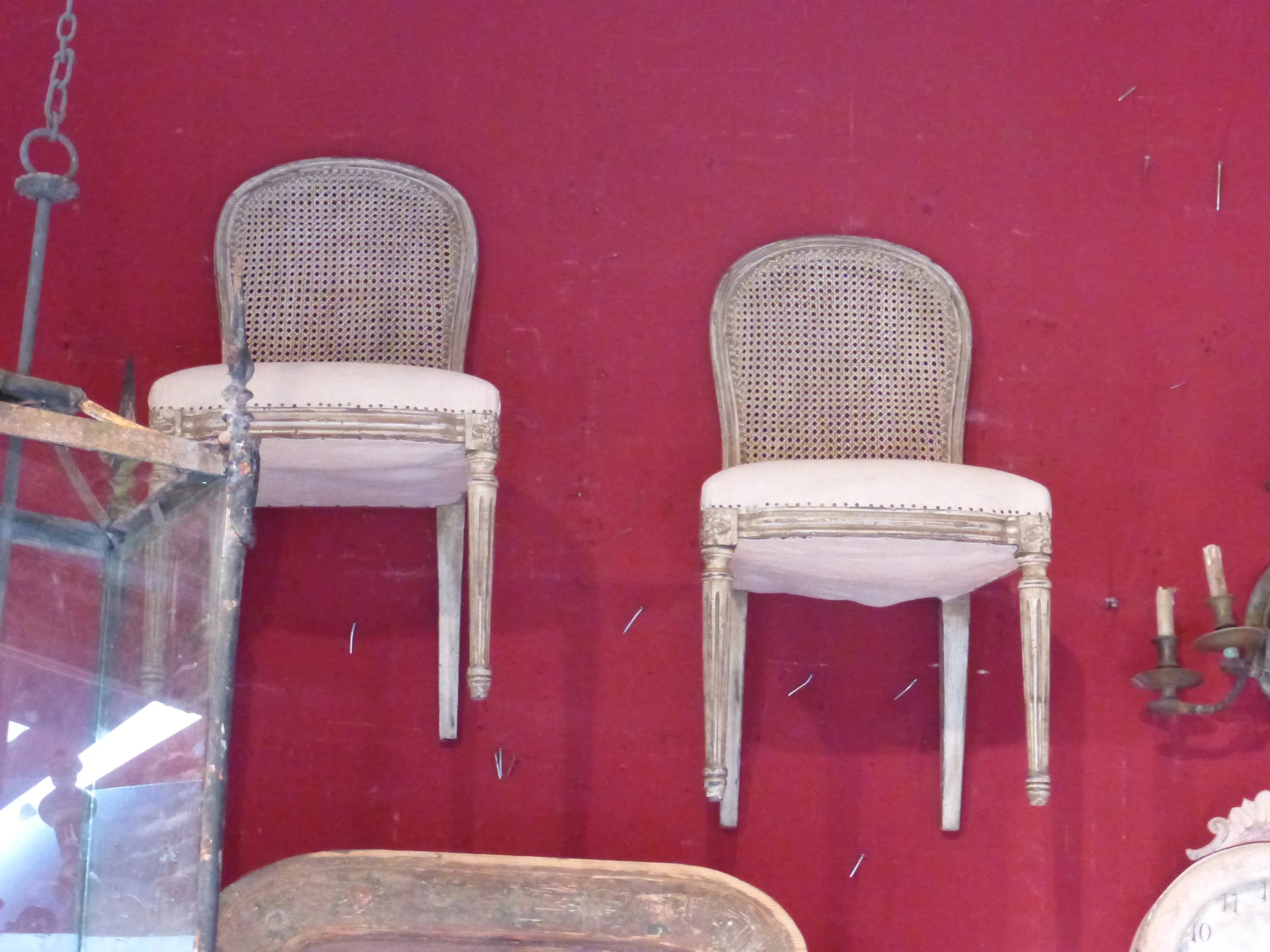 The cane back chairs hanging in one of my favorite booths at Saint-Ouen. The original inspiration for my need to always have some chairs hanging in my booth at Redbriar!