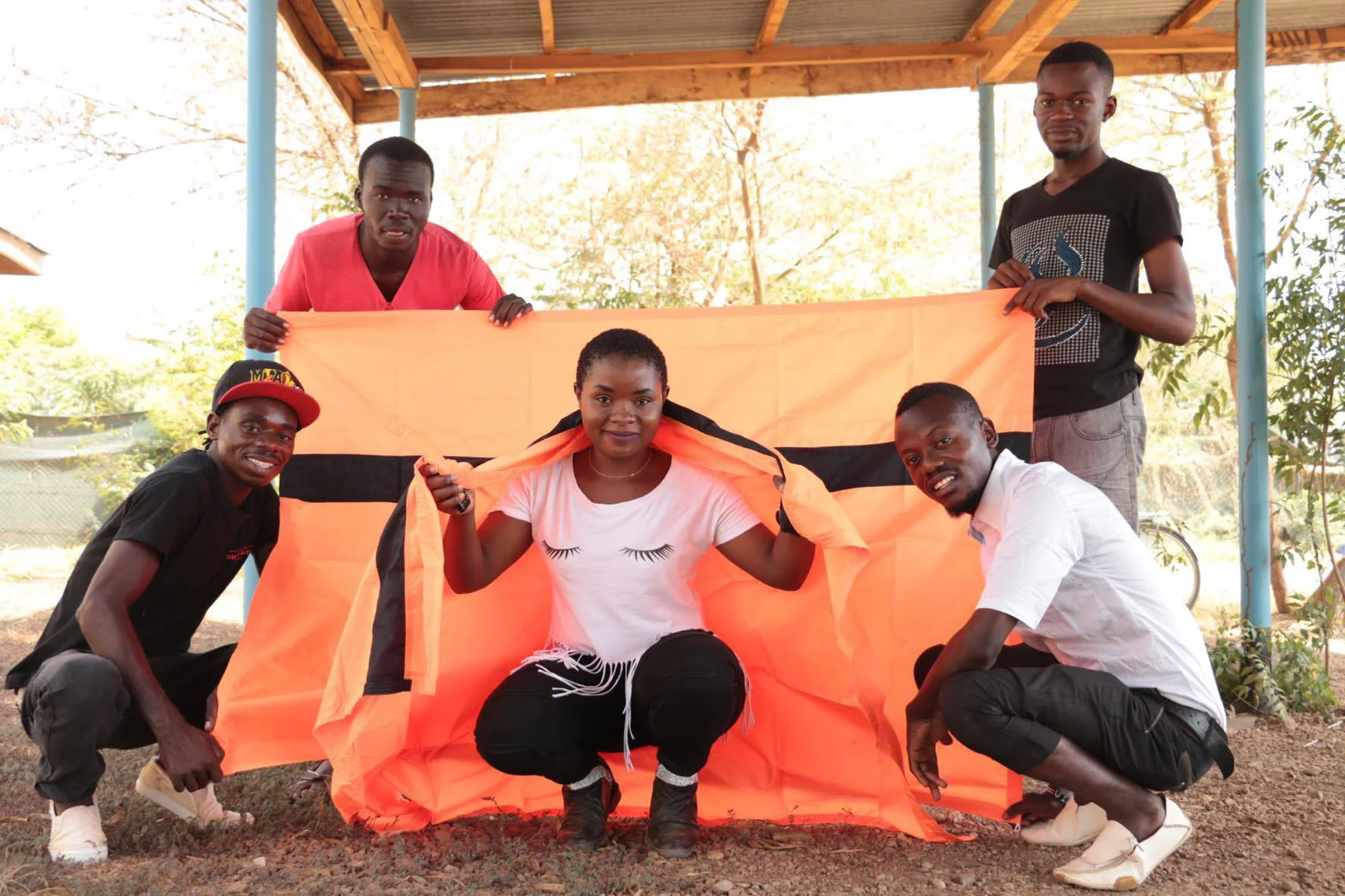 Refugees embracing the flag in the world's biggest refugee camp Kakuma, in Kenya.