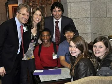 Seated: Jamar Burnette (red sweater), Allan Tran, Emma Lewis (front left) and Joelle Dell'Erede with Parkdale-High Park Liberal MP Gerard Kennedy, left, teacher Alison Mann, and Papineau Liberal MP Justin Trudeau. The students where in Ottawa on Int…