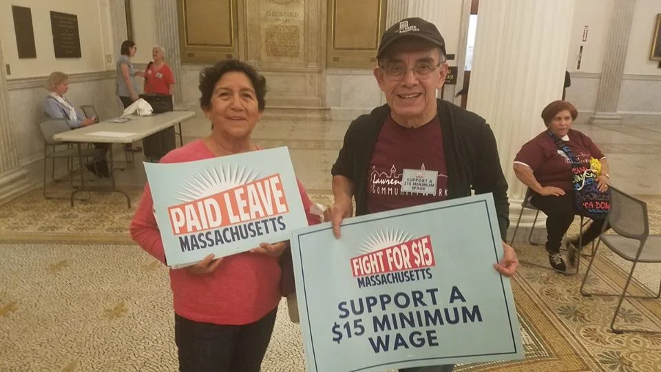 MVP leaders Miguel and Flor showing their support for Paid Leave MA and the Fight For 15 - May 8.