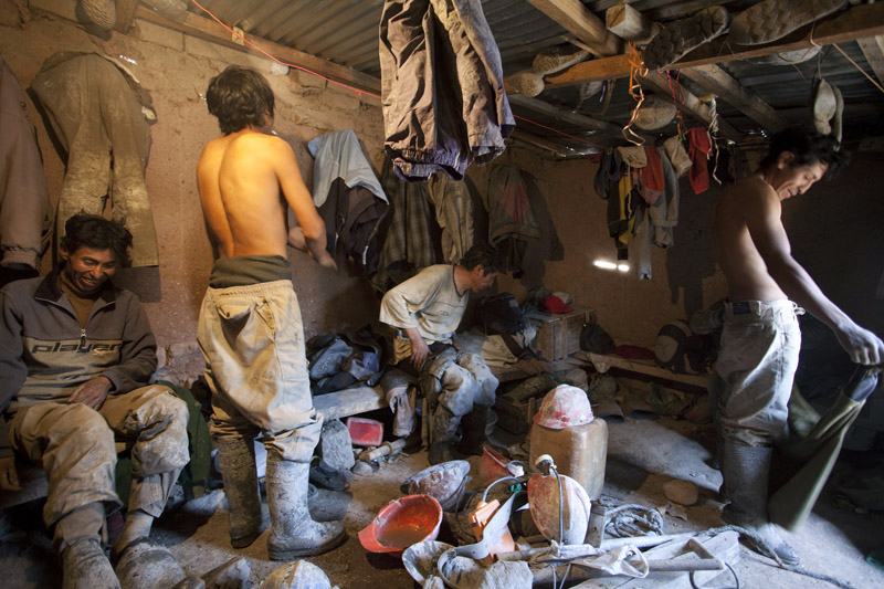  Members of Los Malditos cooperative changing for their work day.&nbsp; 