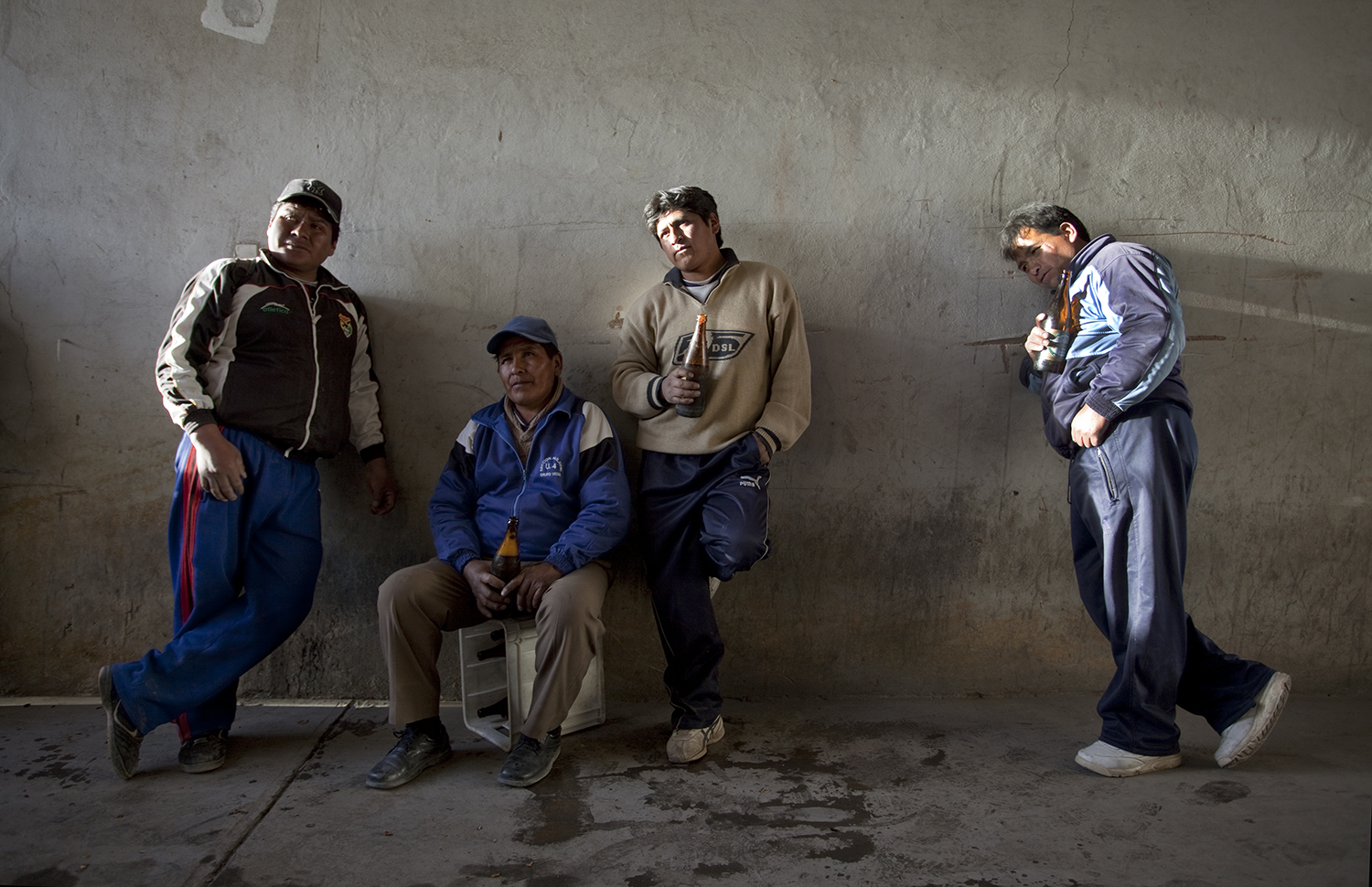 The men sometimes wait around for hours to get paid. The bosses usually provide beer. 