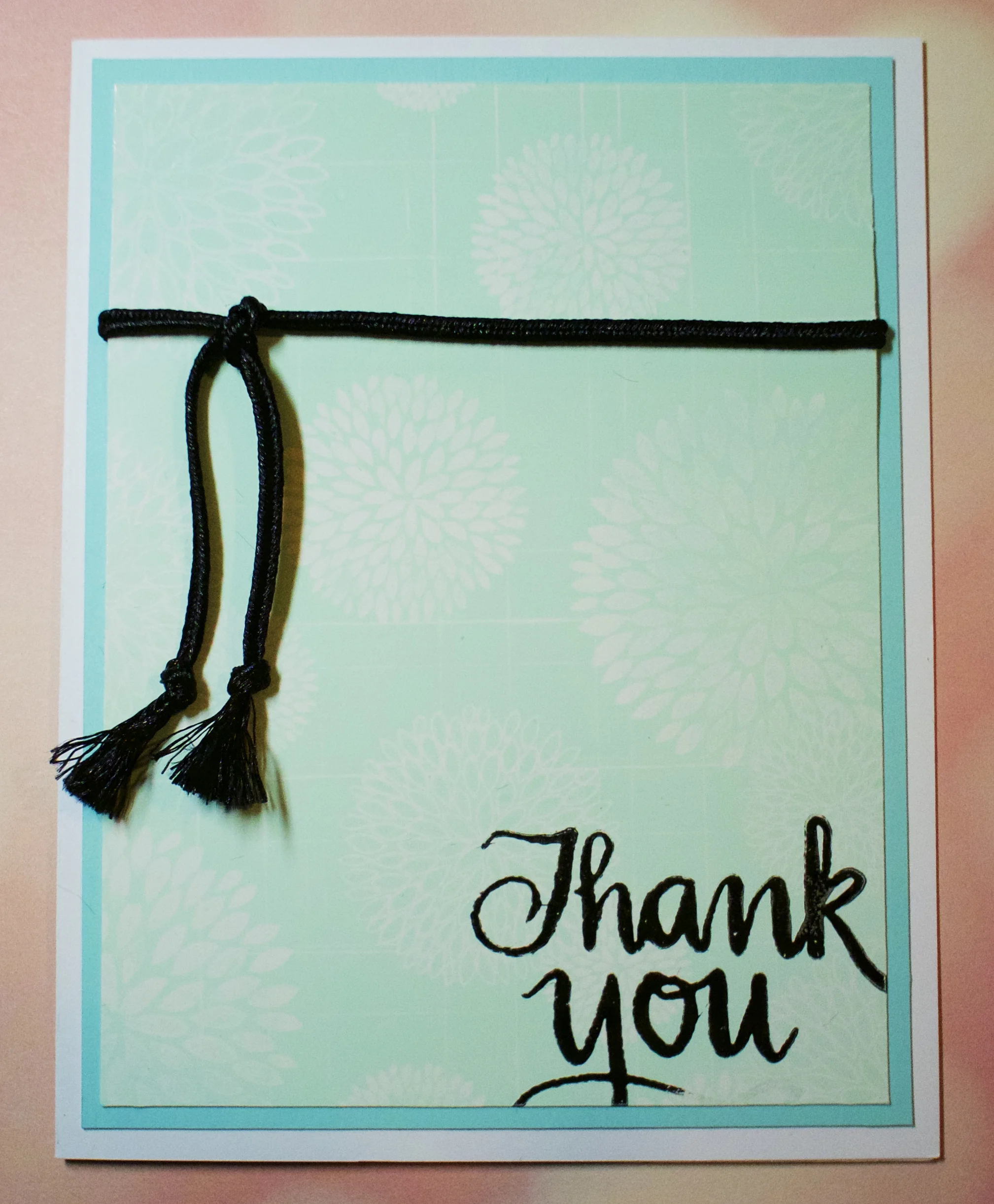 Glossy cardstock stamped with Hero Arts Flower Bursts Pattern in Versamark ink then rubbed wit Adirondack Pool ink. Cardbase is Nenah Solar White layered with Simon Says Stamp Sea Glass cardstock. The sentiment is from a Studio Calico kit stamped in Versafine black ink. 