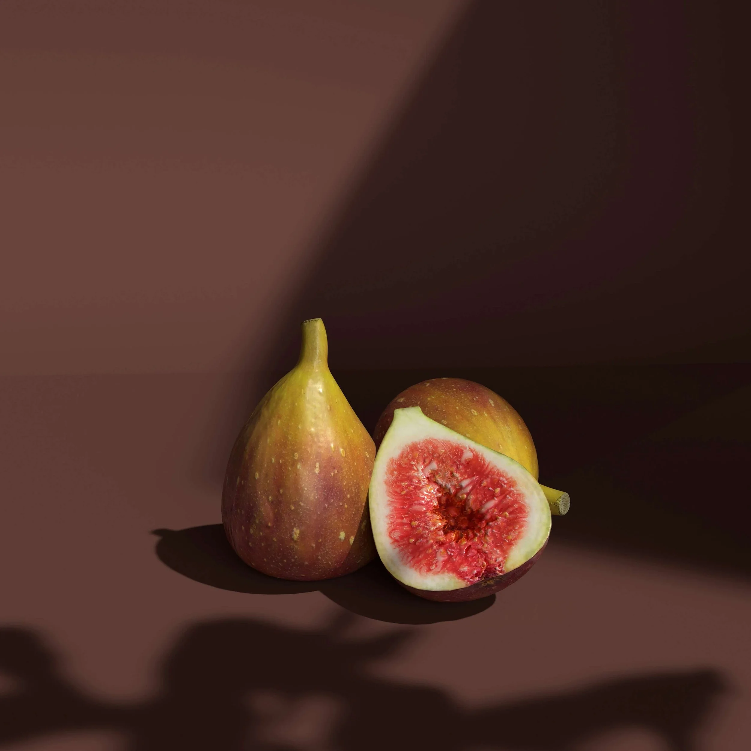 A whole pear, a sliced pear showing red inside, and a partially sliced apple on a dark background.