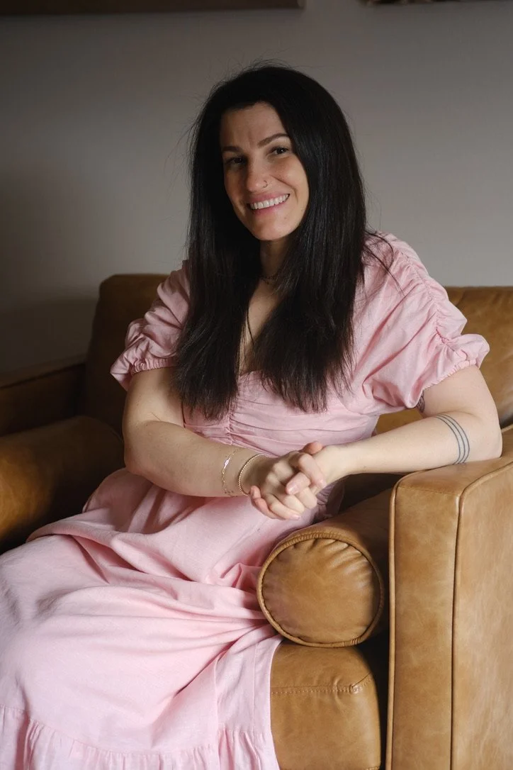 Headshot of Naomi in Pink dress