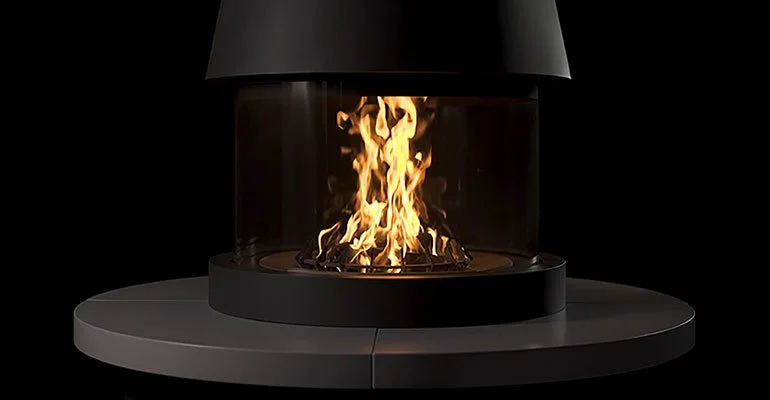 A modern, black, round fireplace with flames inside, set against a dark background.