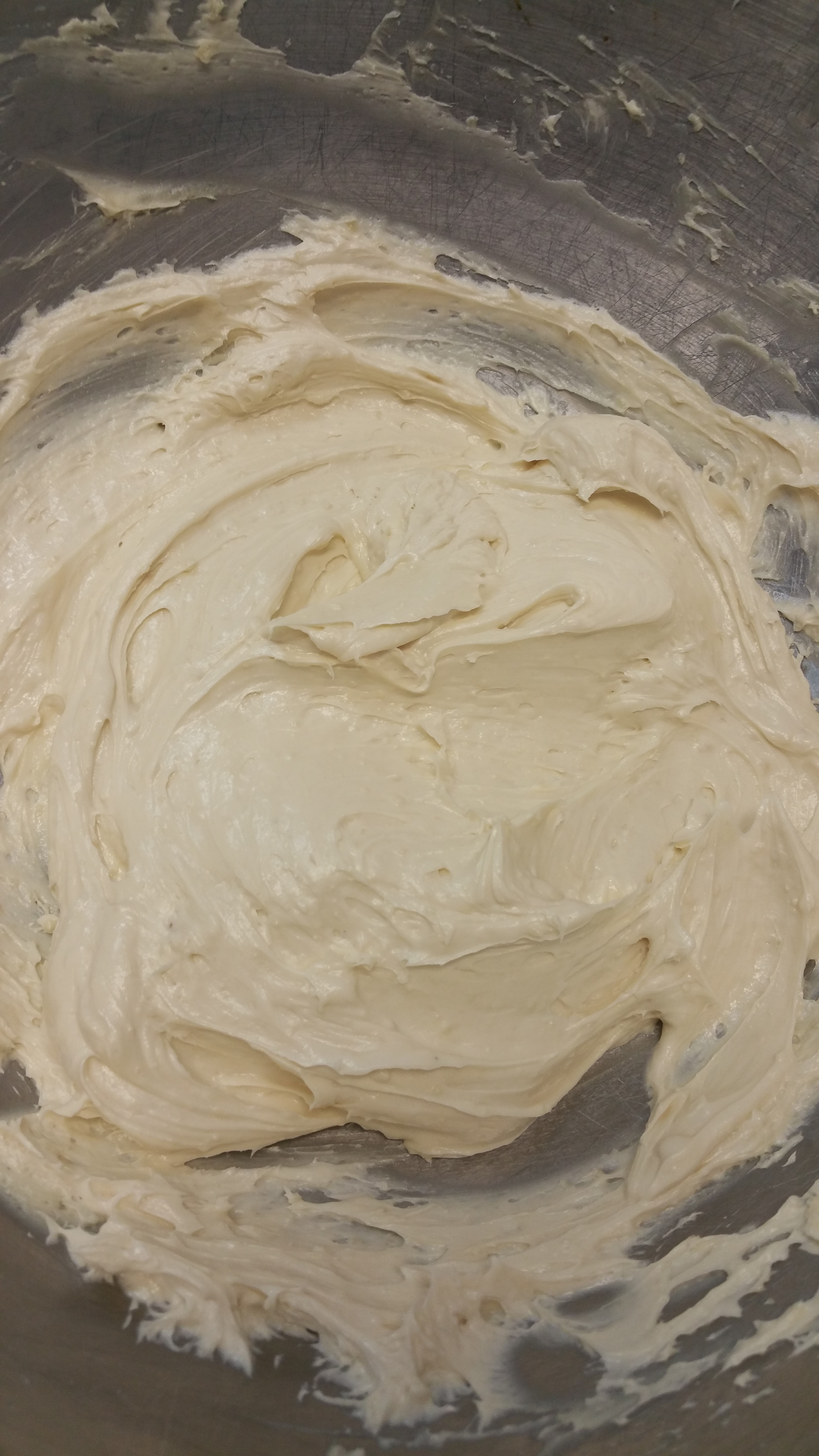 Creamy, smooth, off-white batter in a mixing bowl, likely for baking.