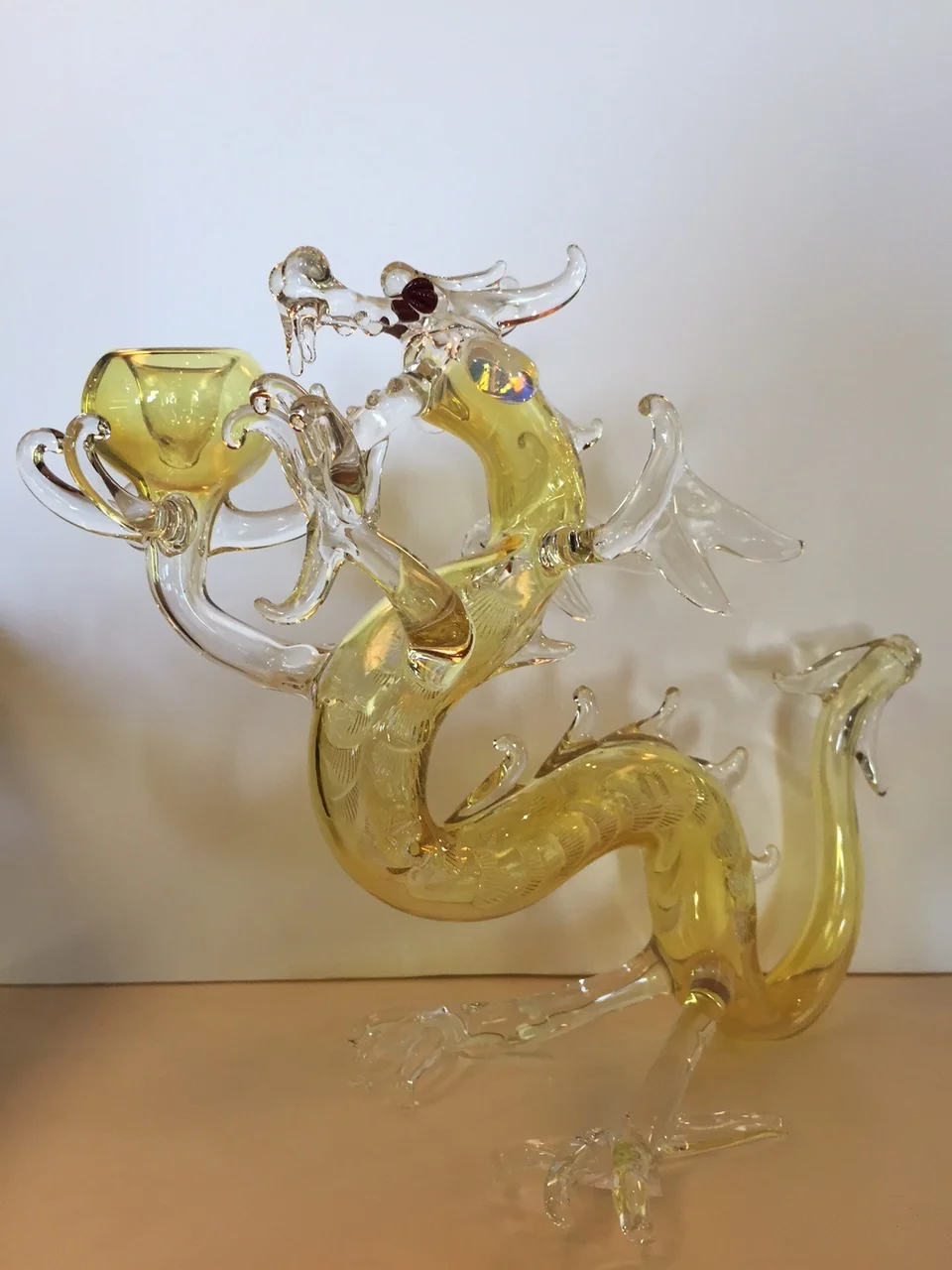 Another local Rochester NY artist piece. This glass dragon stands tall and proud, holding a glass bowl. The tail is the pipe stem. Probably one of the more intricate pieces we carry. Very cool and very rare.