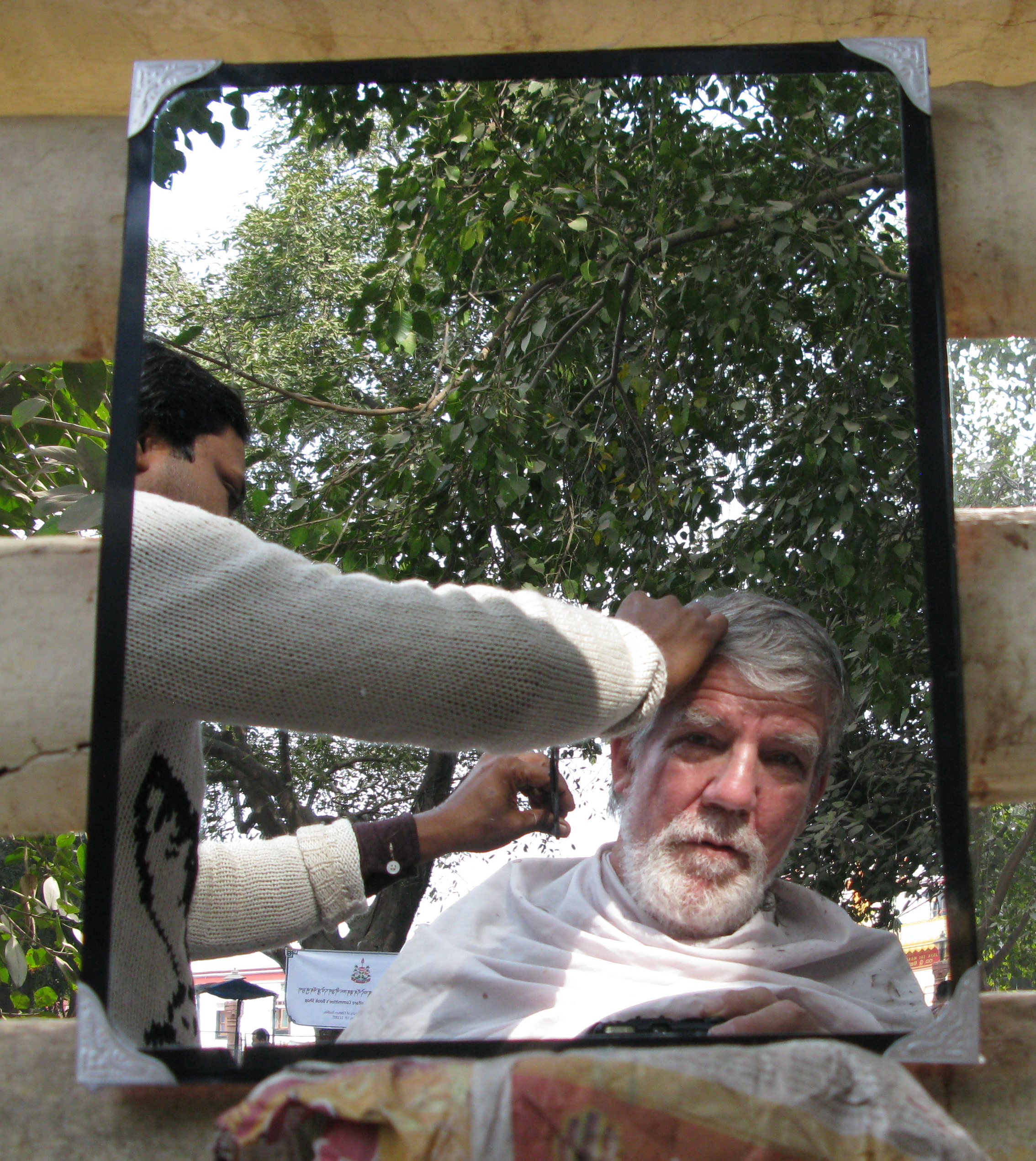Self Portrait, 2013, Canon G-9, the entrance to the MahaBodhi Temple, Bodh Gaya, India. On our last day at the temple, we made offerings to the people along the path A little boy kept looking up at me hopefully, but by then I had run out of change.