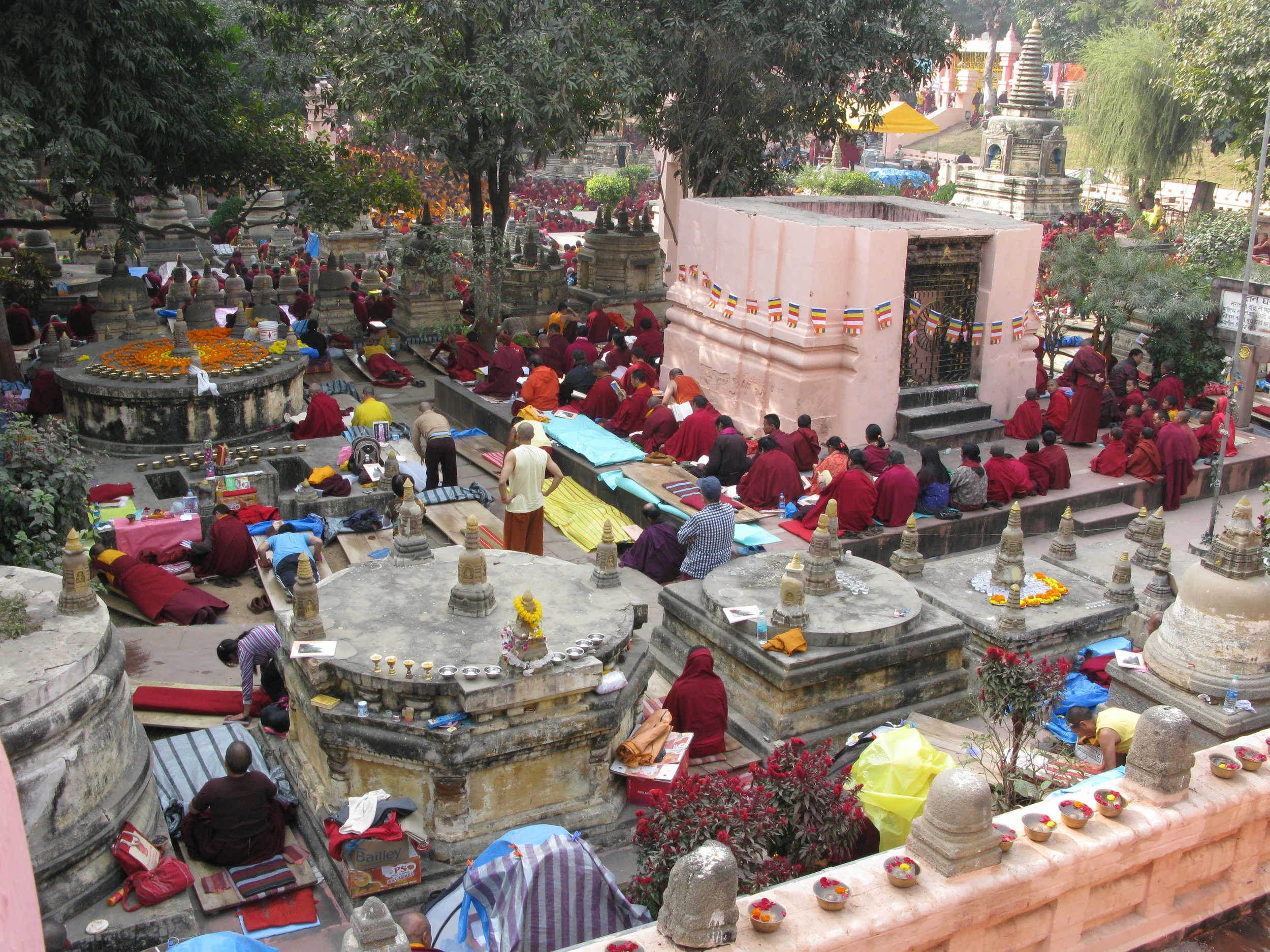  &nbsp;&nbsp; The monks, nuns, and lay people here are taking refuge/making prostrations to the Buddha, dharma,&nbsp; sangha, and also perhaps to teachers and dharma protectors. There are offering mandalas of flowers and offering bowls filled with wa