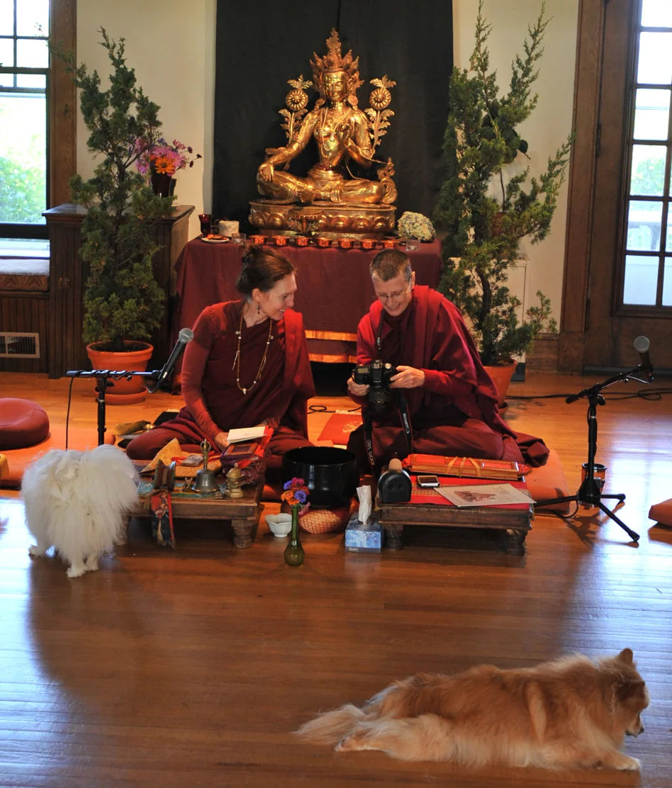 My two favorite lamas, Lama Willa Miller and Lama Karma Chotso looking over photos during a teaching break in front of the Tara Shrine at Wonderwell Mountain Refuge in Springfield, New Hampshire. Both women are devoted to the dharma in the Tibetan Buddhist tradition, and lead retreats, teachings, and discussions on all aspects of Tibetan meditative practices.