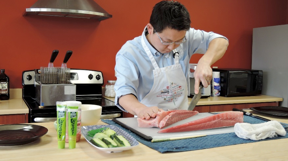 Here Jun trims the blood line from the second loin