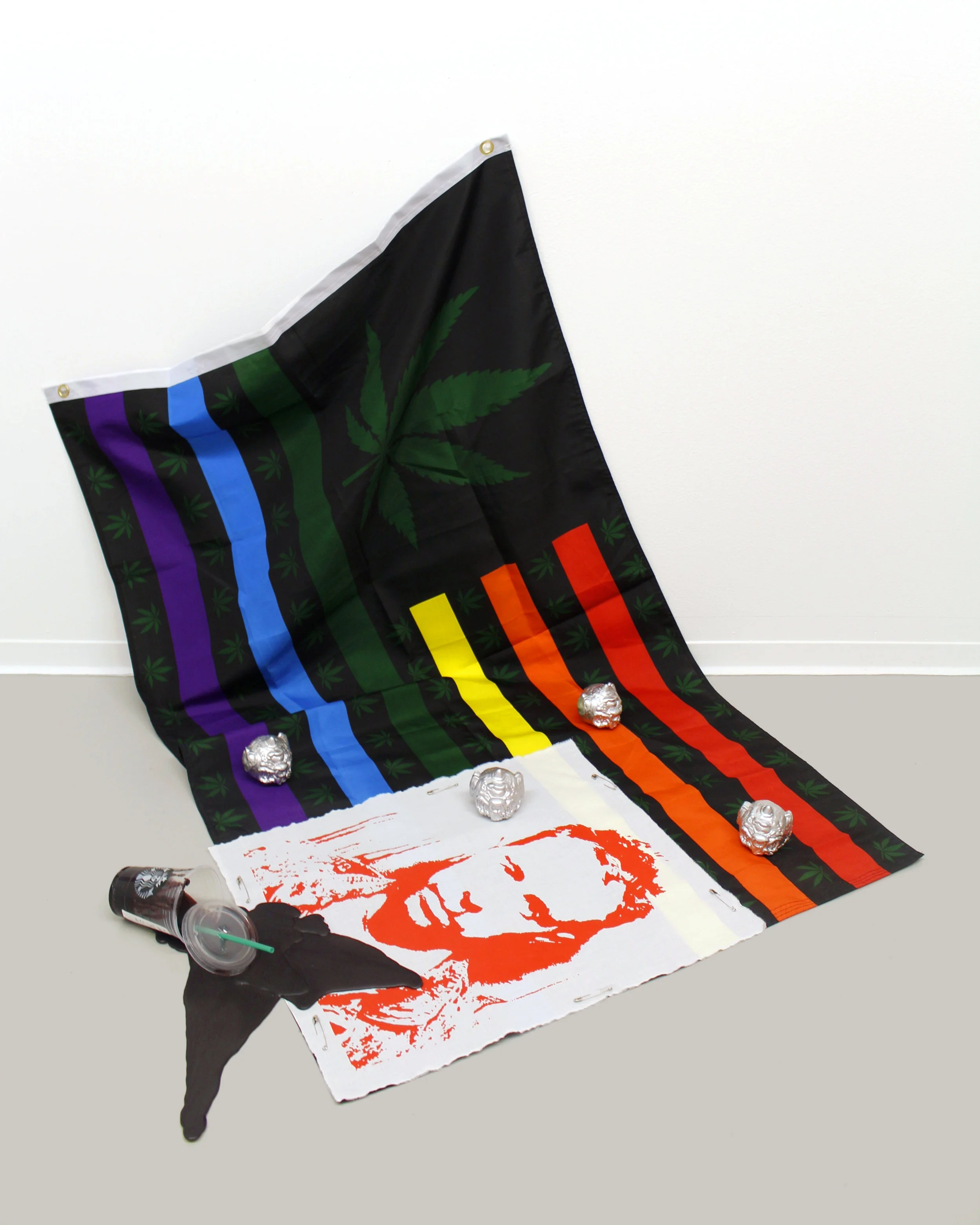 Publicity Stunt Wax, acrylic on cotton, enamel, Starbucks™ cup, flag Various dimensions