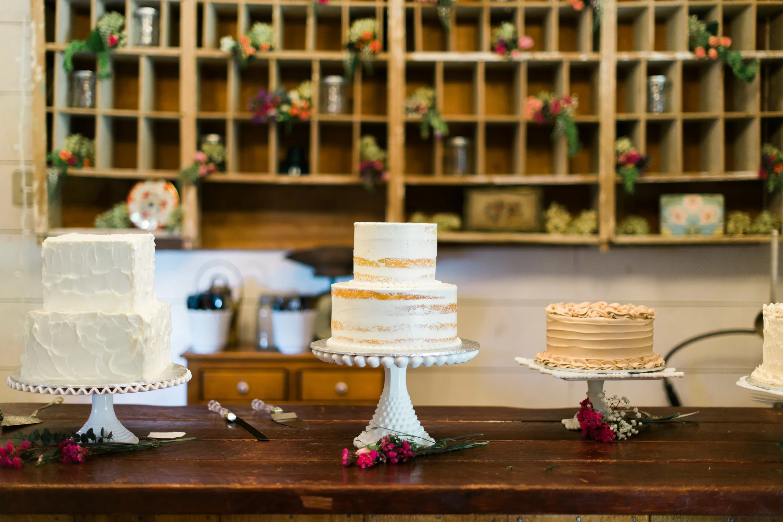 The cake table was full of beautiful cakes, including this popular "naked" cake.