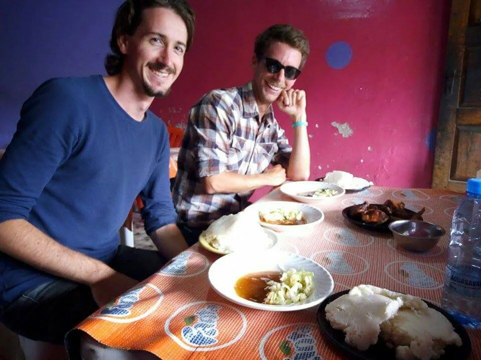 Trying out some yummy Zambian cuisine. Photo: N. Langkamp
