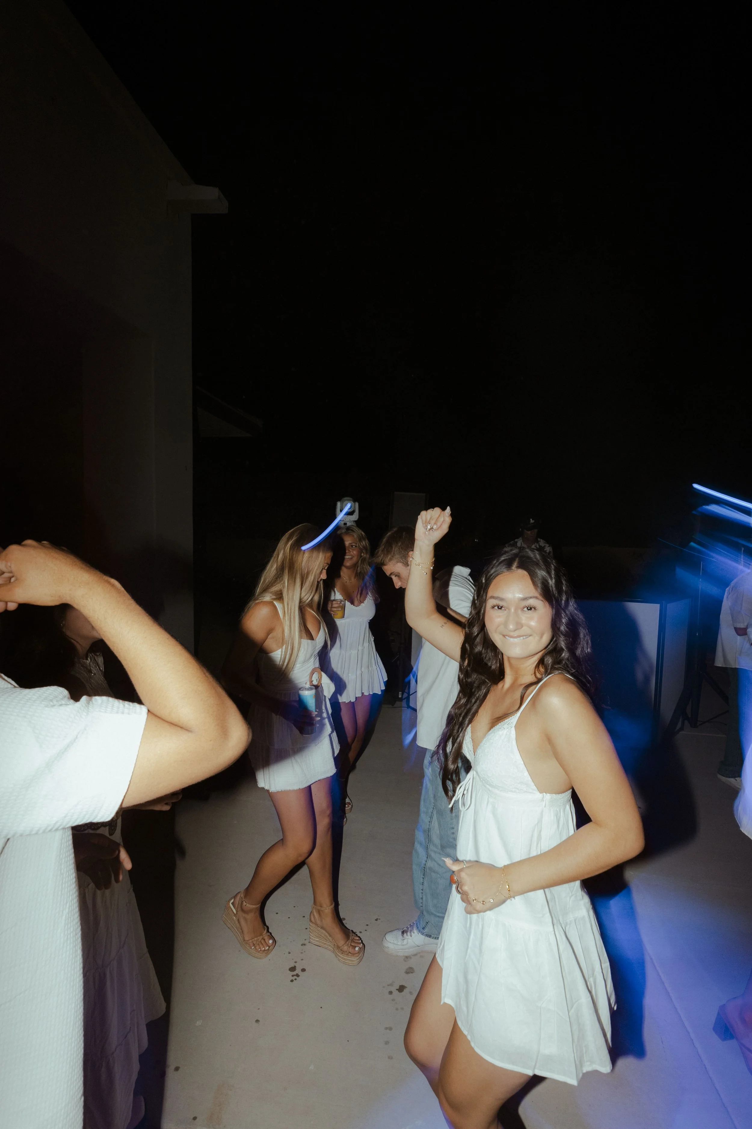High school graduation party with seniors celebrating in a backyard