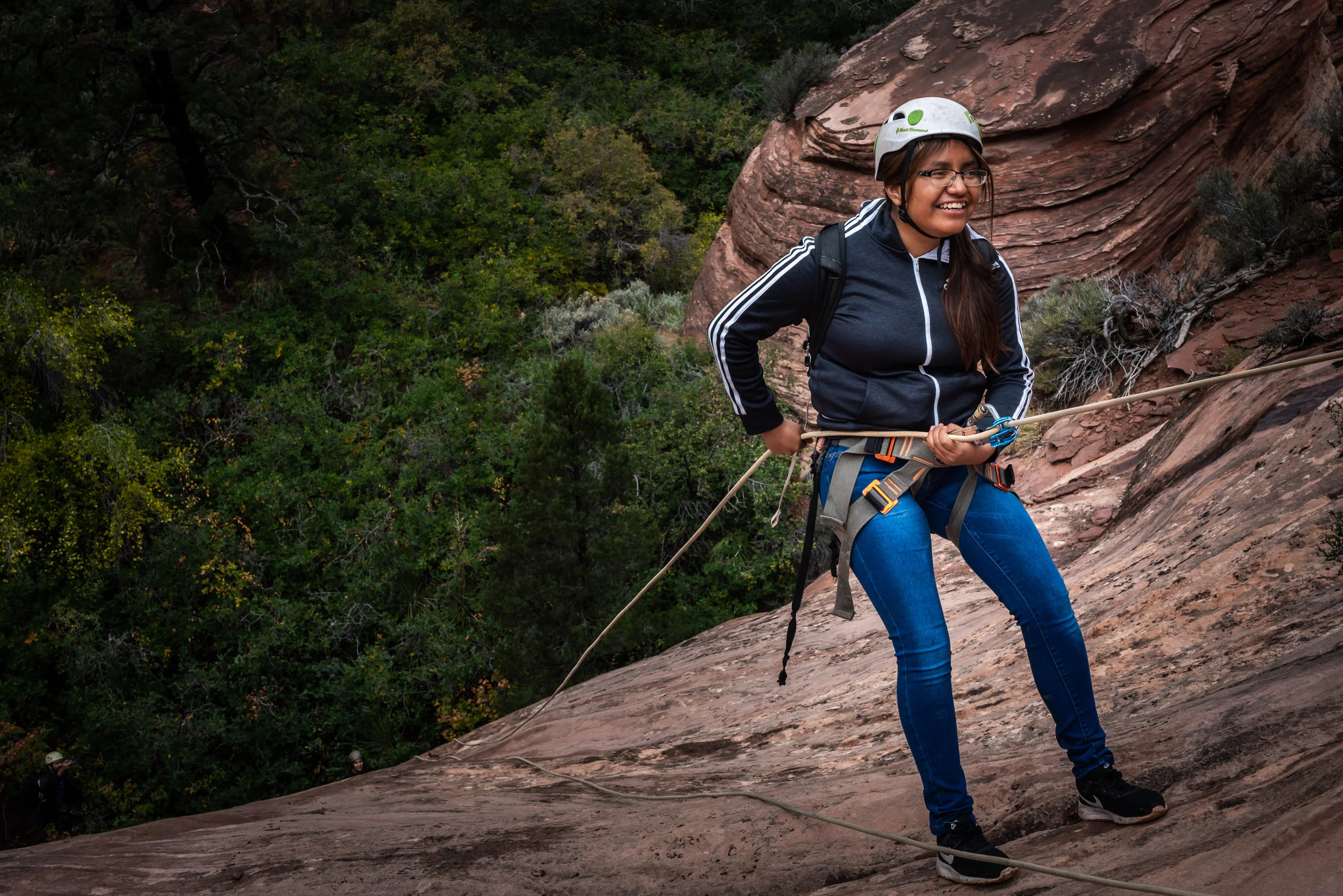 Adrienna rappelling in Zion National Park. PC: Josef Kissinger