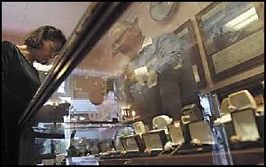 FAMILY PIECES: Estate Jewelers’ owner Nina Goehring and her husband, Edward, go through their inventory. Some of their heirloom pieces come in their original boxes, including items originally sold by longtime Redding jeweler A.F. Dobrowsky.