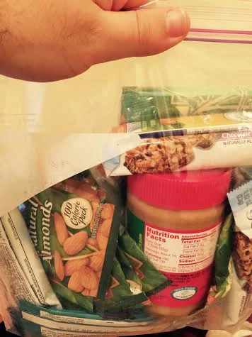 My bag of snacks for Barcelona. Yes that's a full jar of peanut butter and yes this fit in my backpack too.