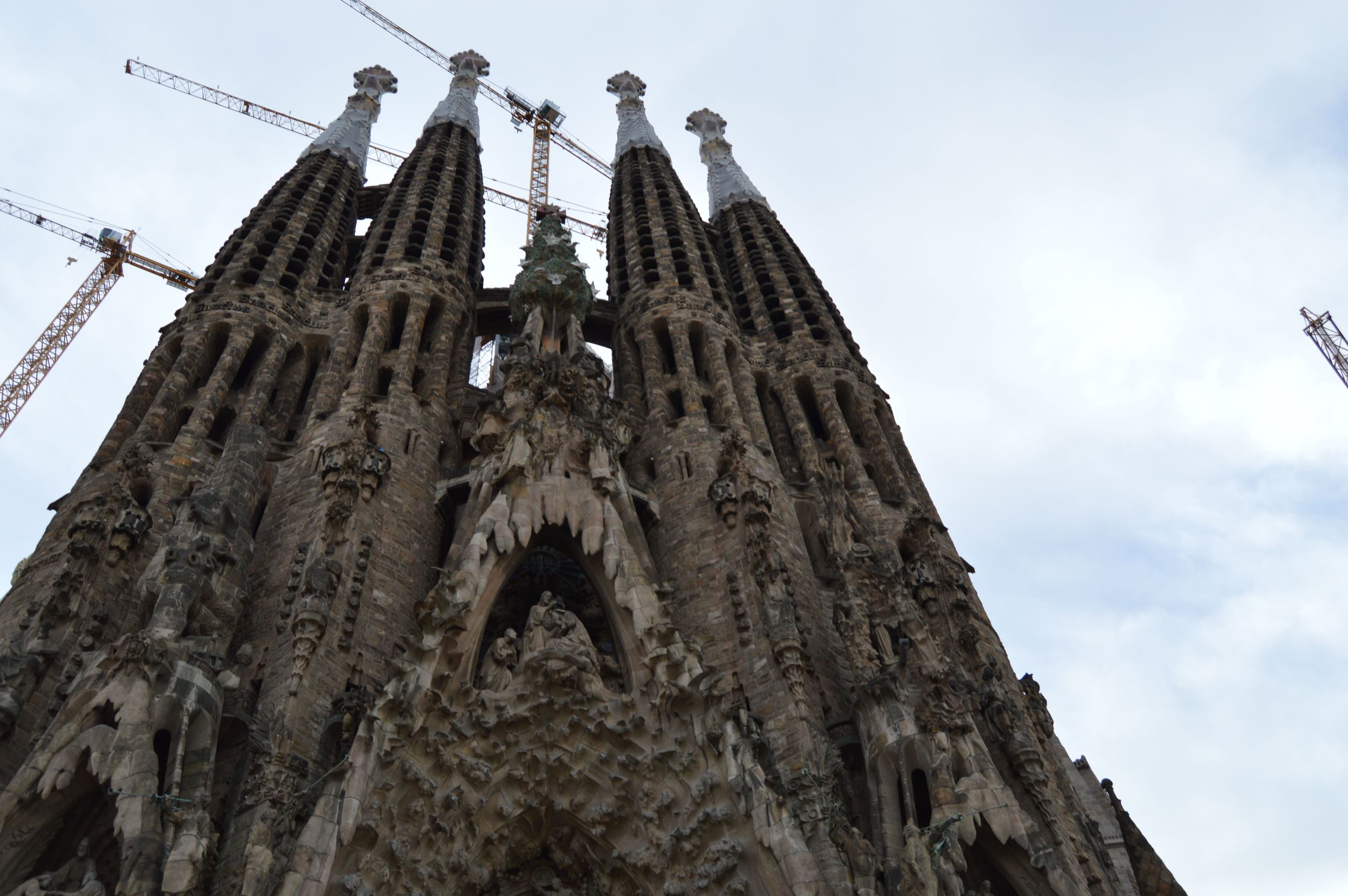 This is called the "Birthing Facade" and depicts the birth of Jesus. The facade on the other side, which you might think looks similar because of the towers, actually depicts Jesus' crucifixion and death. Gaudí only lived to see part of this facade completed. The other facade is much newer. Photo by Max Siskind.