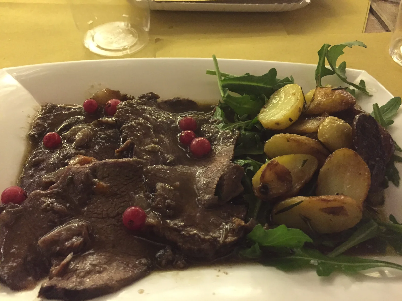 The slow-cooked meat and the potatoes. Complete with its very own plastic plate. Photo by Max Siskind.