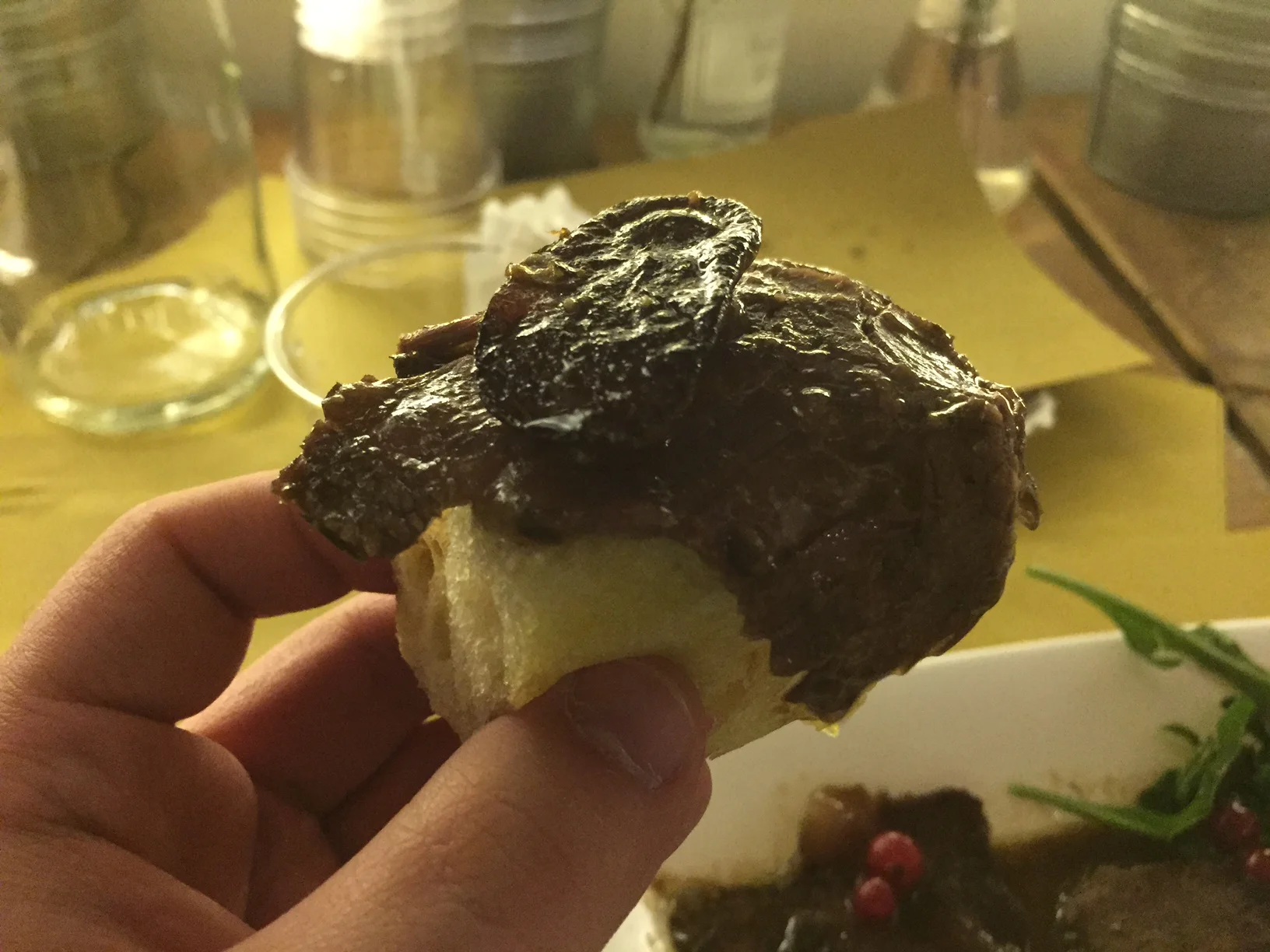 The perfect bite. Potato on top of the meat on top of the homemade focaccia bread. Photo by Max Siskind.