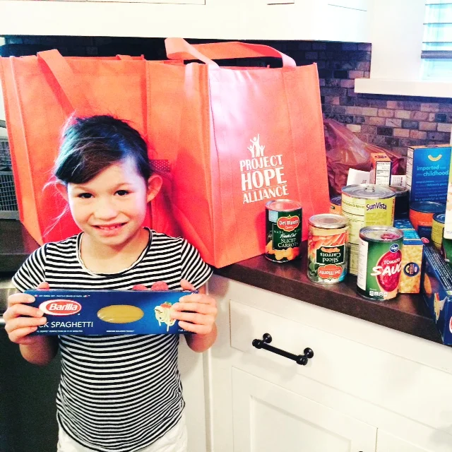 Gracie shopped and put together bags for Project Hope Alliance.  The project was perfect for her (7 yrs old) since St. Andrew’s provided the bags with a shopping list printed on the back and a note card in each bag with kid friendly talking poi…