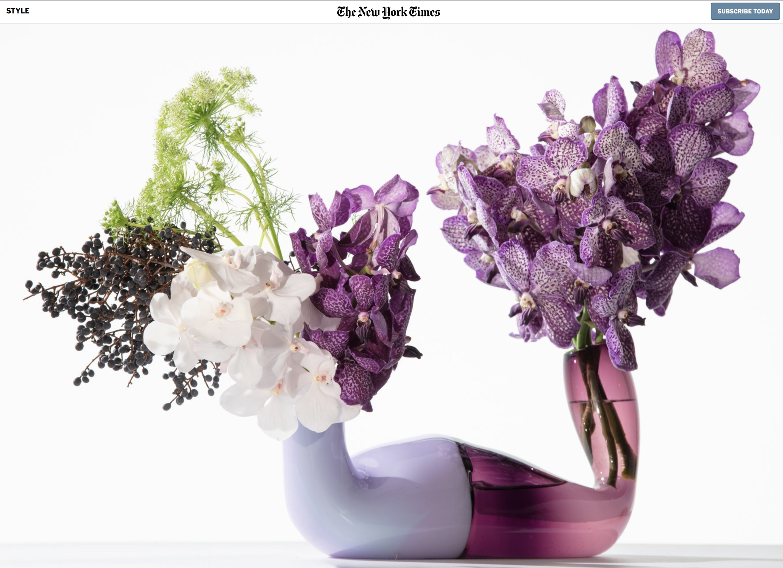 The Pushmepullme vase by Andi Kovel and Justin Parker of Esque Studio. On the purple side, dark purple Vanda diamond orchids. On the lavender side, white Vandas, with Queen Anne’s lace and blackberries. $2,200; esque-studio.com.CreditTony Cenicola/The New York Times